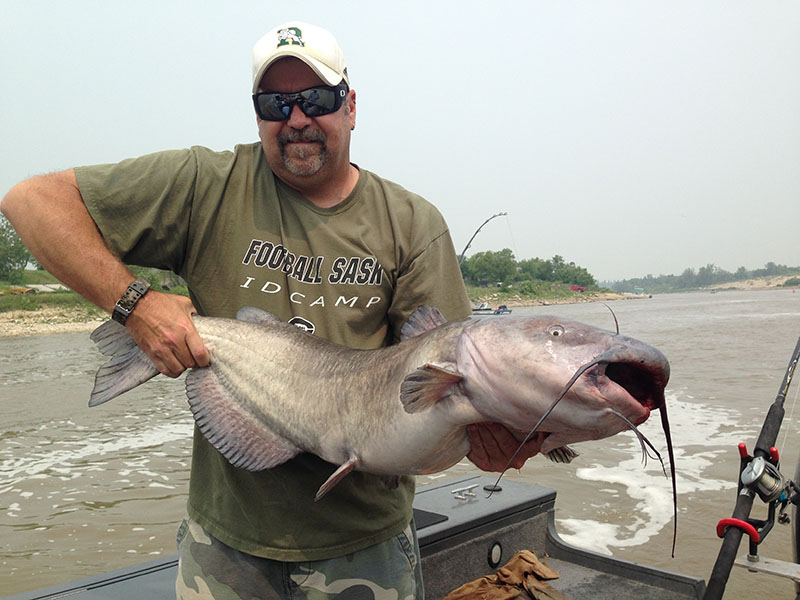 Blackwater cats guest with38 Inch Monster channel catfish Winnipeg CatFishing guide service Blackwater Cats guests with a trophy catfish